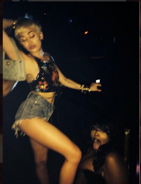 Miley Cyrus Causes Controversy As She Spits At Fans During Bangerz Show Watch The Video OK